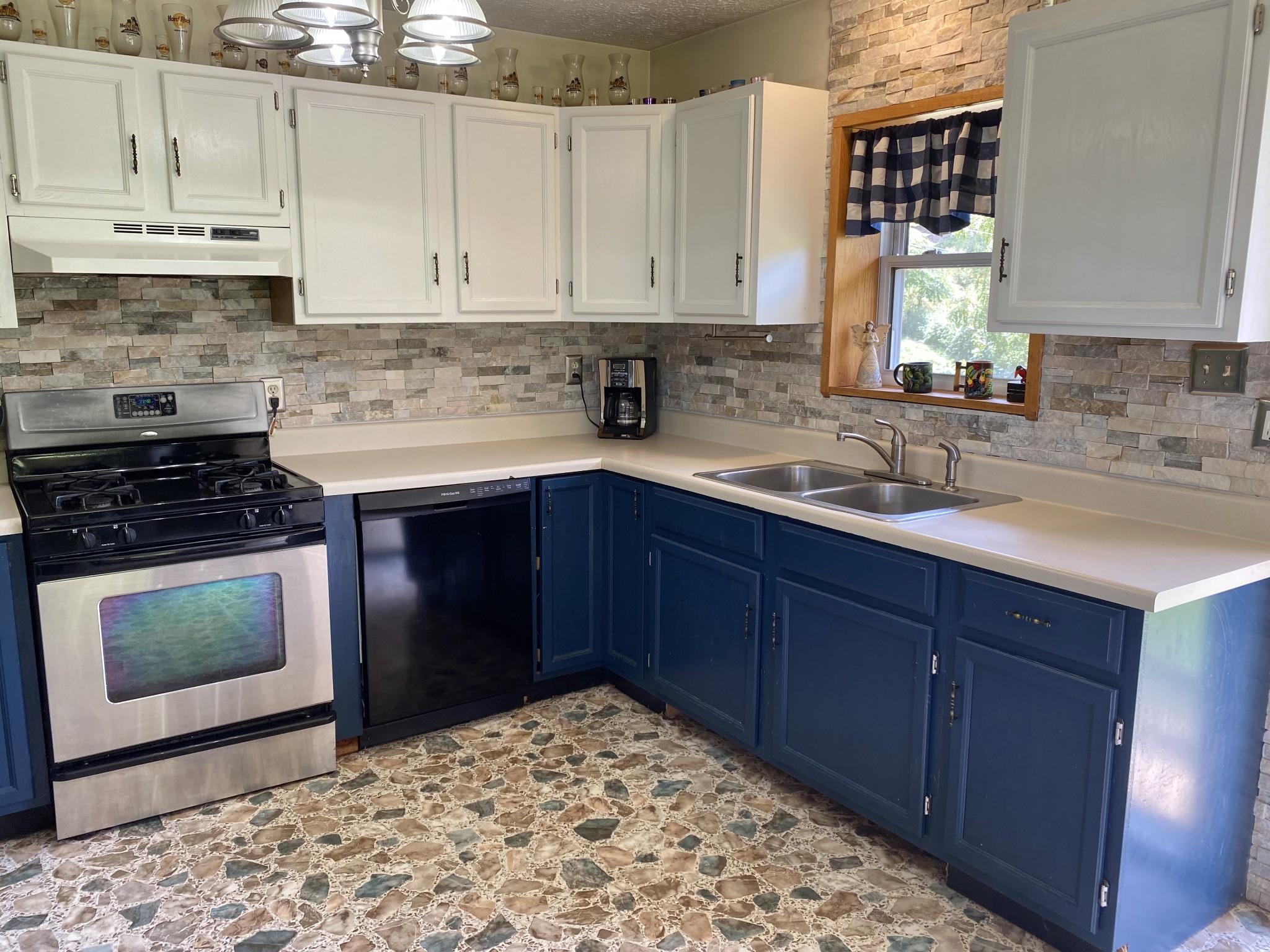 2528 Adamson Branch Road Liberty, TN 37095 - Photo 11 of 22 a kitchen with stainless steel appliances granite countertop a stove a sink and a microwave