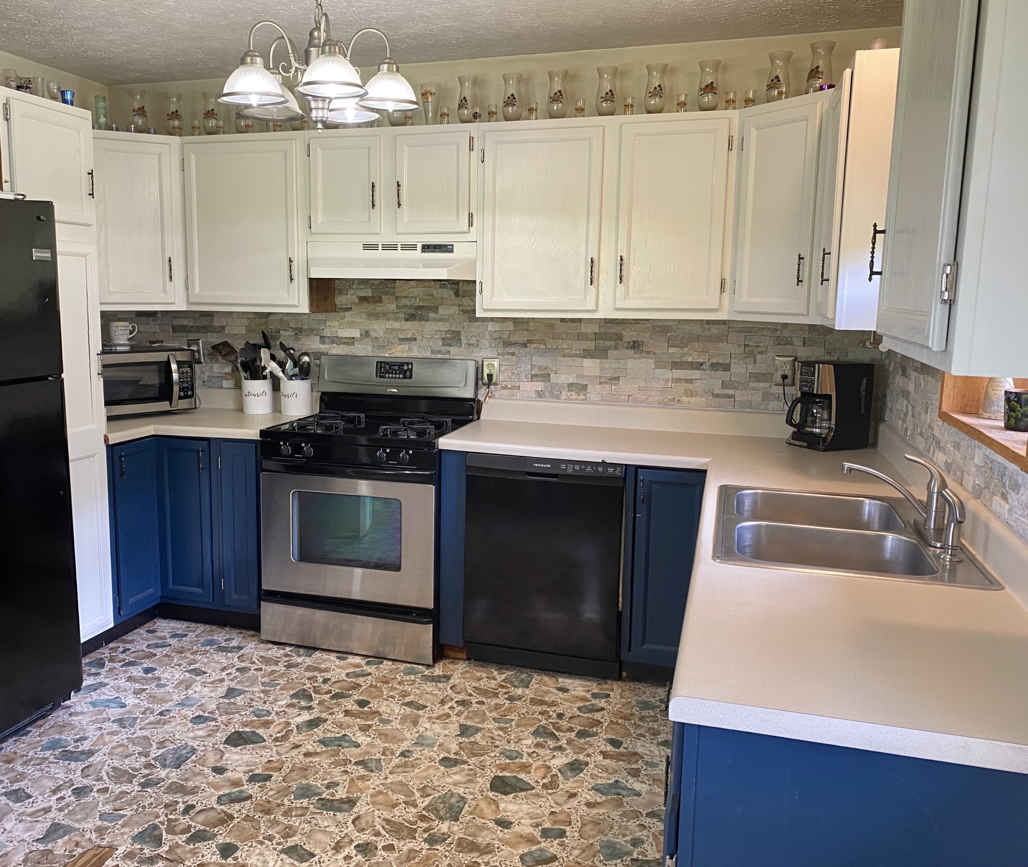 2528 Adamson Branch Road Liberty, TN 37095 - Photo 12 of 22 a kitchen with stainless steel appliances granite countertop a stove a sink and a refrigerator
