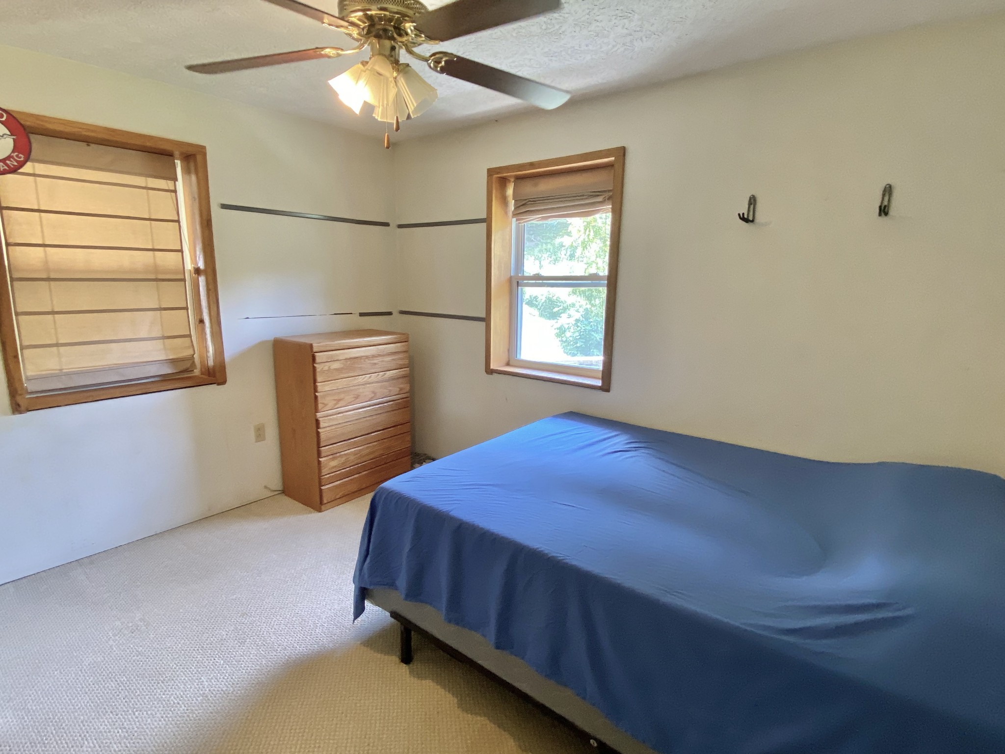 2528 Adamson Branch Road Liberty, TN 37095 - Photo 14 of 22 a bedroom with a bed and a chandelier