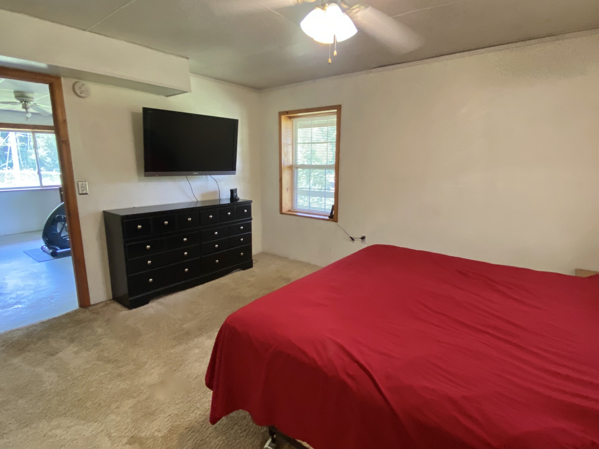 2528 Adamson Branch Road Liberty, TN 37095 - Photo 18 of 22 a bedroom with a bed and a flat tv screen on dresser