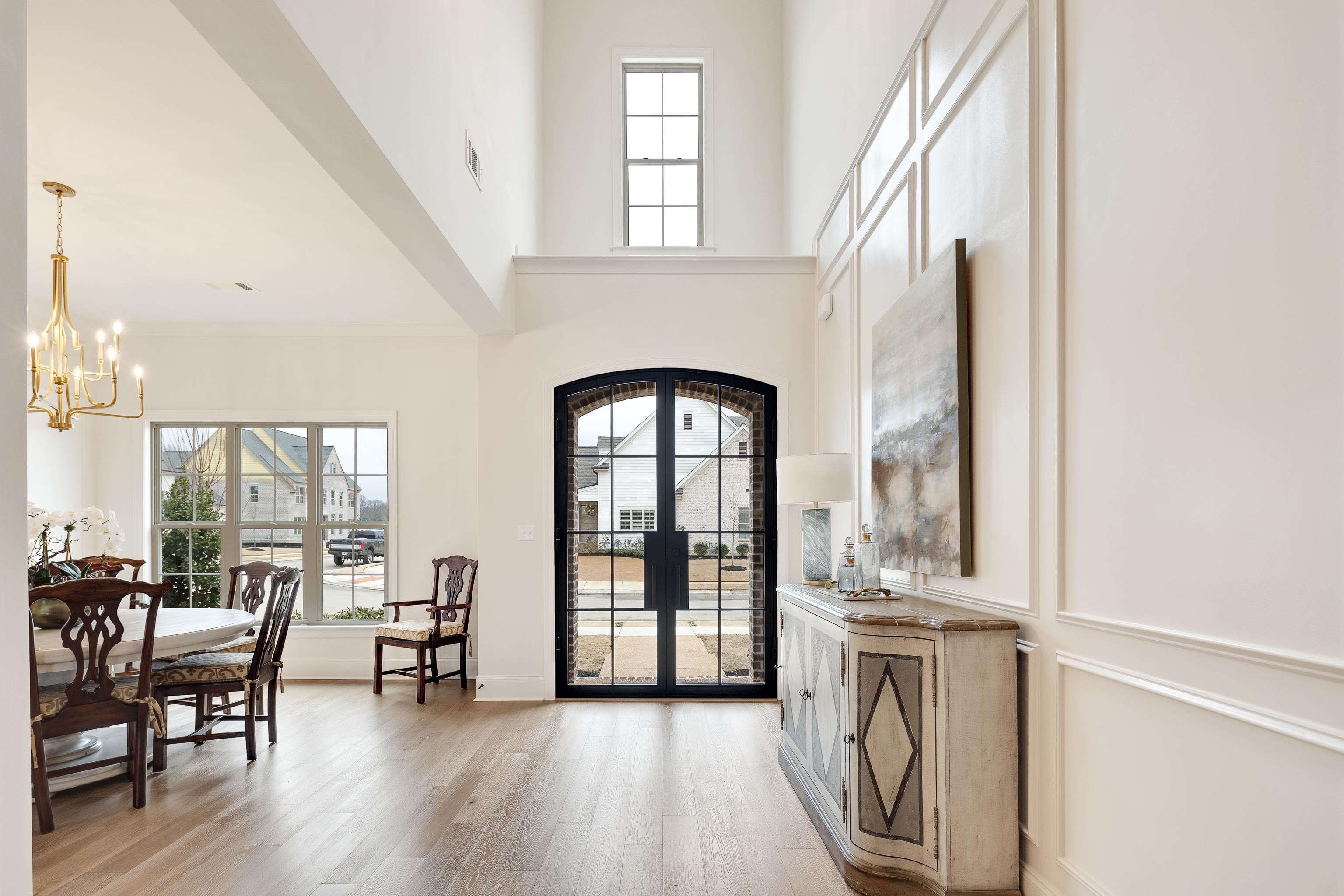292 Keisie Lane Collierville, TN 38017 - Photo 4 of 40 Entryway featuring a high ceiling, french doors, hanging lights, and light wood finished floors