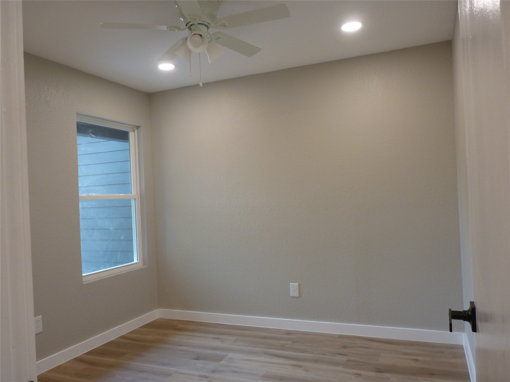 Undisclosed Address Austin, TX 78745 - Photo 13 of 20 an empty room with wooden floor and windows