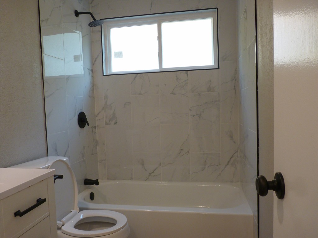 Undisclosed Address Austin, TX 78745 - Photo 17 of 20 a bath room with a toilet and a bath tub