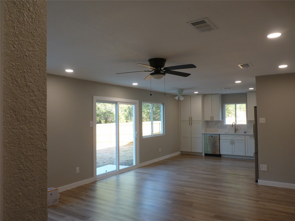 Undisclosed Address Austin, TX 78745 - Photo 4 of 20 a view of an empty room with window and wooden floor