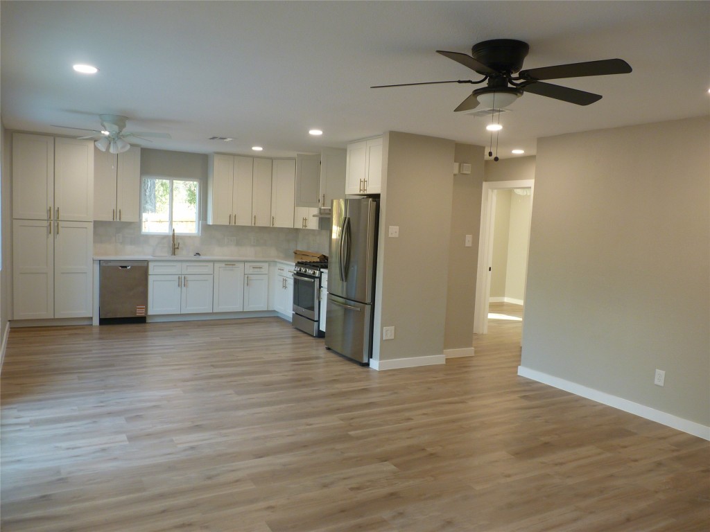 Undisclosed Address Austin, TX 78745 - Photo 5 of 20 a large kitchen with stainless steel appliances granite countertop a refrigerator and a sink
