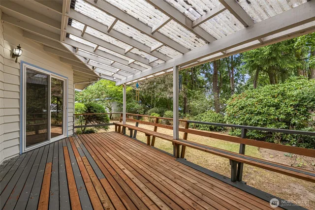 a view of outdoor space with wooden floor