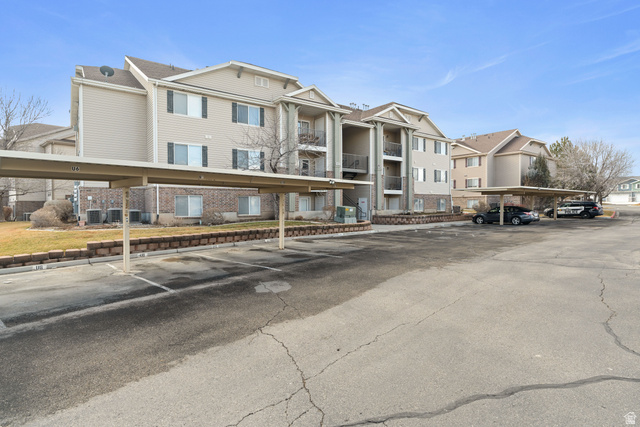 8204 North Cedar Springs Road, Unit 2 Eagle Mountain, UT 84005 - Photo 17 of 17 View of building exterior with covered parking