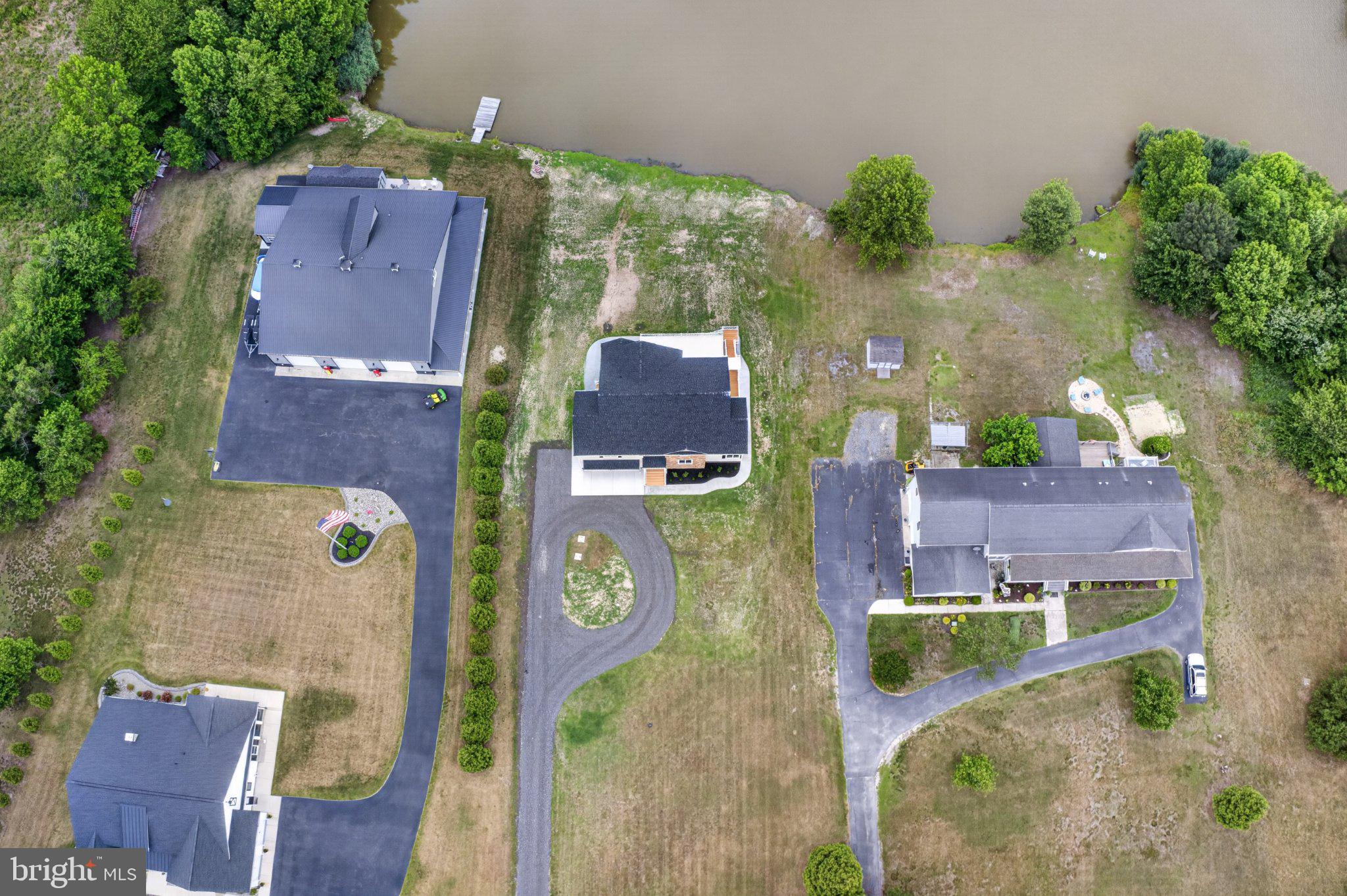 34029 Peppers Corner Road Millville, DE 19967 - Photo 89 of 101 Lakeside homes with lush greenery.