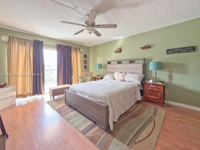 a bedroom with a large bed and a large window