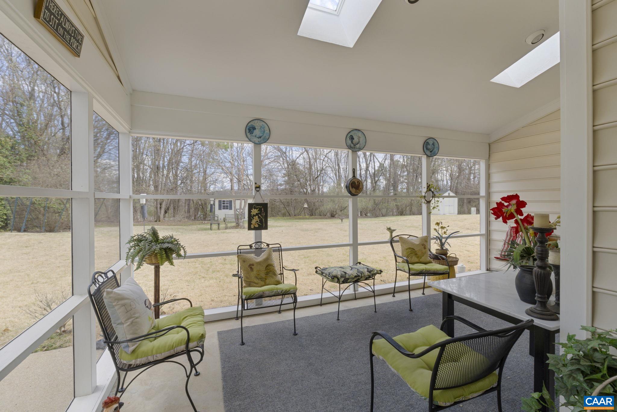 1673 Old Brook Road Charlottesville, VA 22901 - Photo 5 of 41 a living room with furniture and a potted plant