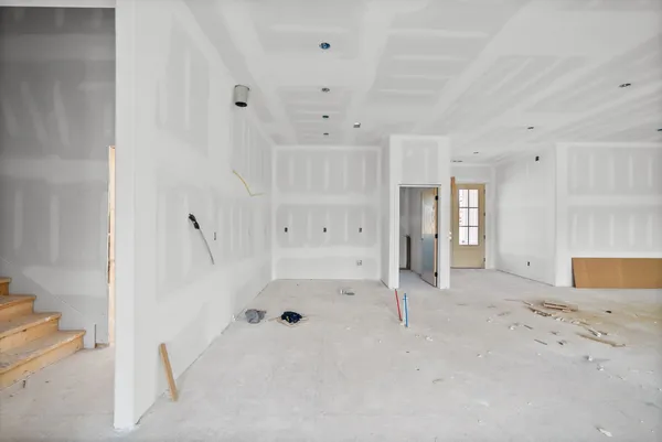 a view of an empty room with a window