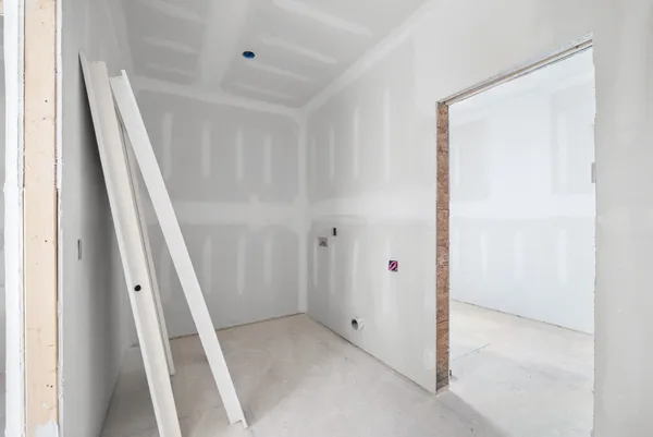 a view of a hallway with workspace and windows