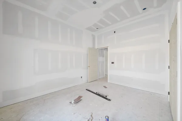 a work room with furniture and a window