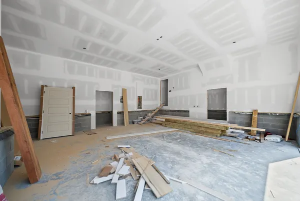 a view of a livingroom with an empty space and a window