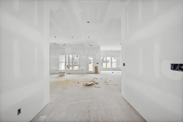 a view of empty room with a fireplace