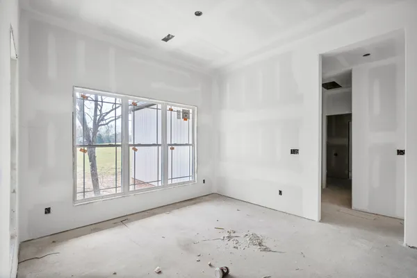 a room with gym equipment and a window