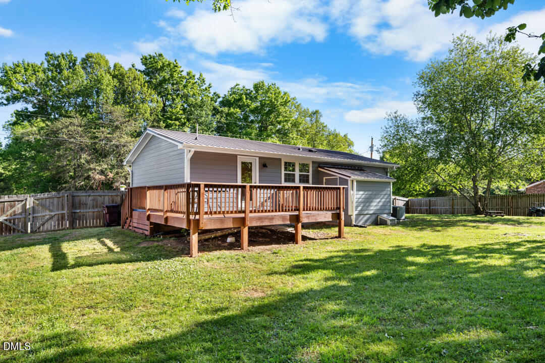 454 Cedar Creek Road Timberlake, NC 27583 - Photo 28 of 39 a view of a house with a yard and sitting area