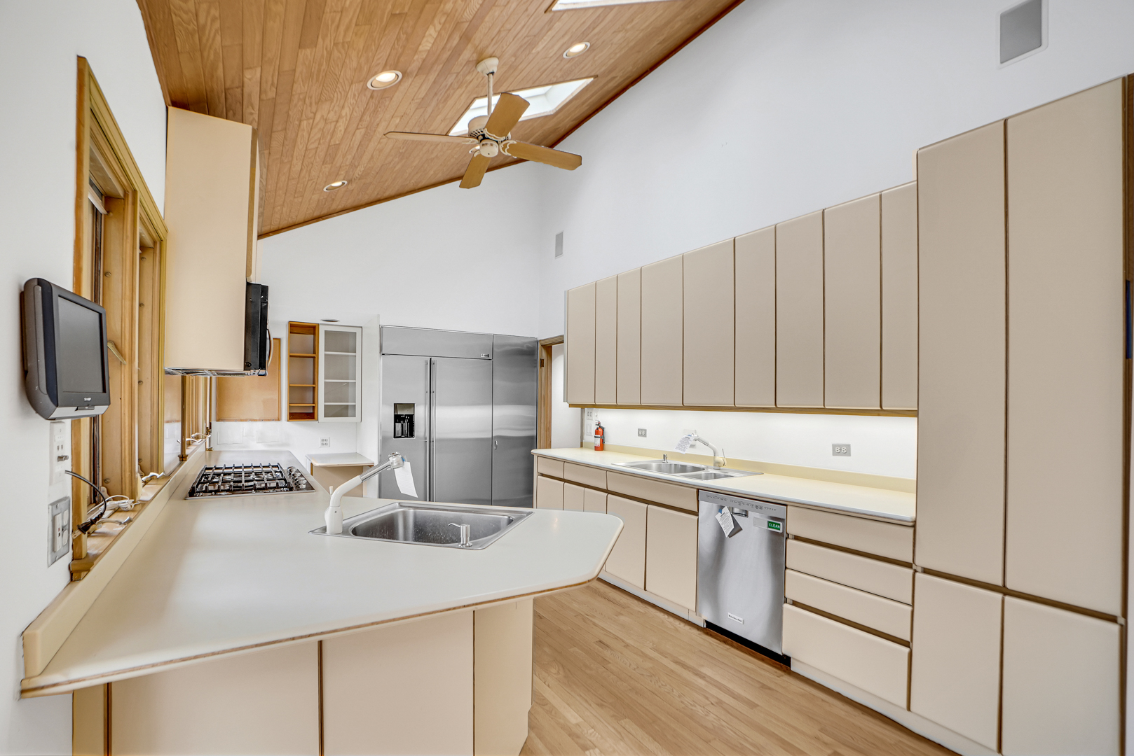 109 Sunset Ridge Road Northfield, IL 60093 - Photo 27 of 30 a kitchen with a sink a stove and cabinets