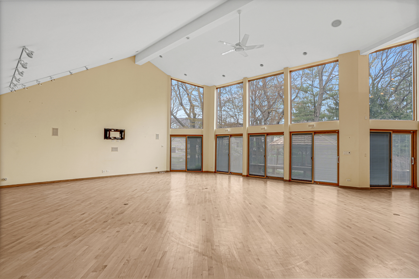 109 Sunset Ridge Road Northfield, IL 60093 - Photo 5 of 30 a view of an empty room with a window and wooden floor