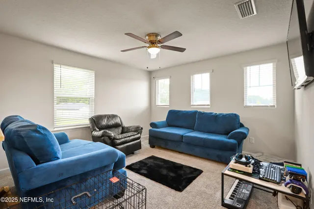 a living room with furniture and a window