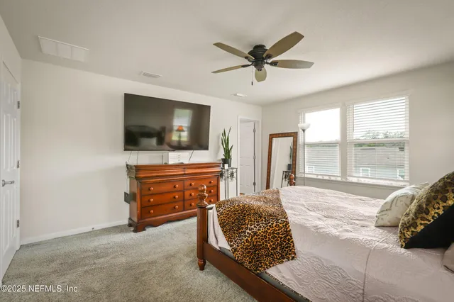 a living room with a couch and a flat screen tv