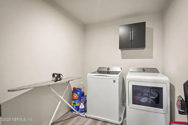 a utility room with dryer and washer