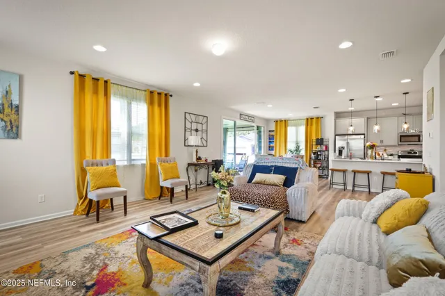 a living room with furniture and a table