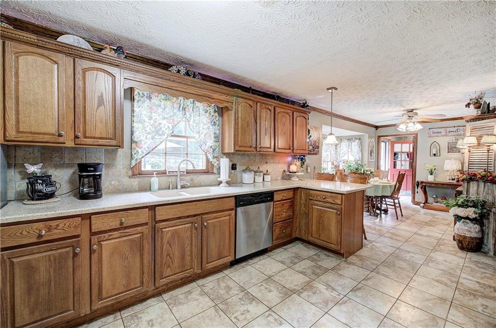 3637 Nebo Road Hiram, GA 30141 - Photo 22 of 63 a kitchen with cabinets appliances and a large window