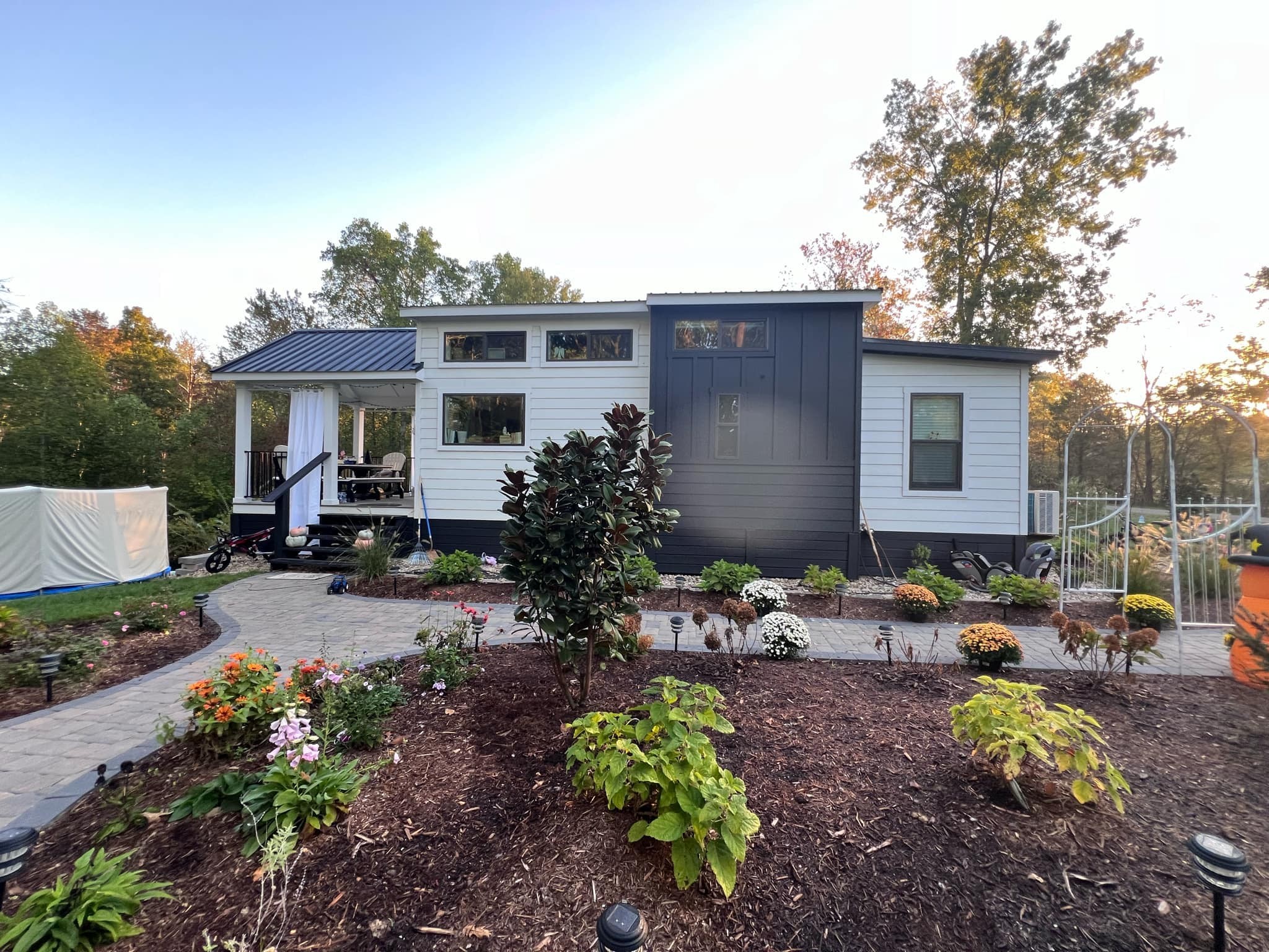 a view of a house with yard and sitting area