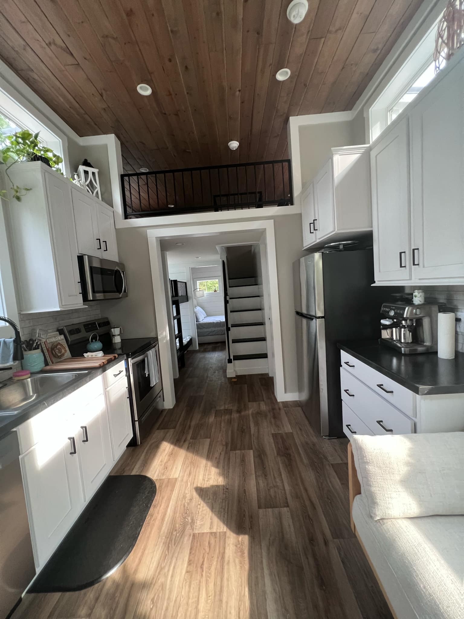 1530 Prince Road Big Sandy, TN 38221 - Photo 19 of 31 a kitchen with granite countertop a refrigerator oven a sink dishwasher and wooden cabinets with wooden floor