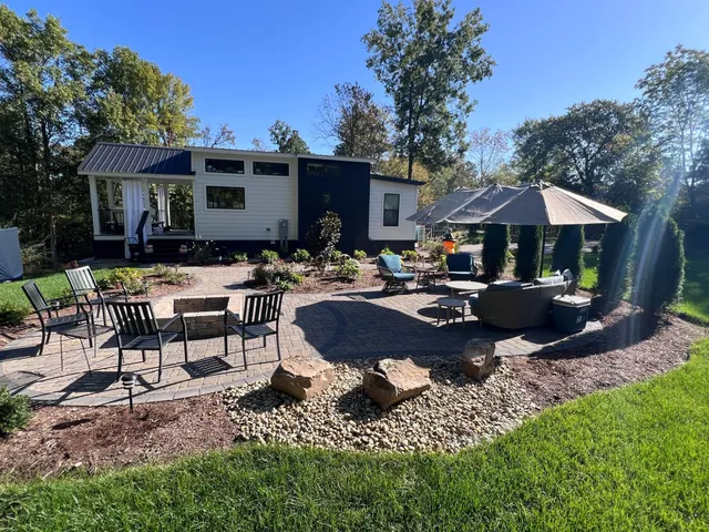 a swimming pool view with a seating space