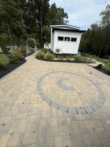 a living room with furniture floor to ceiling window