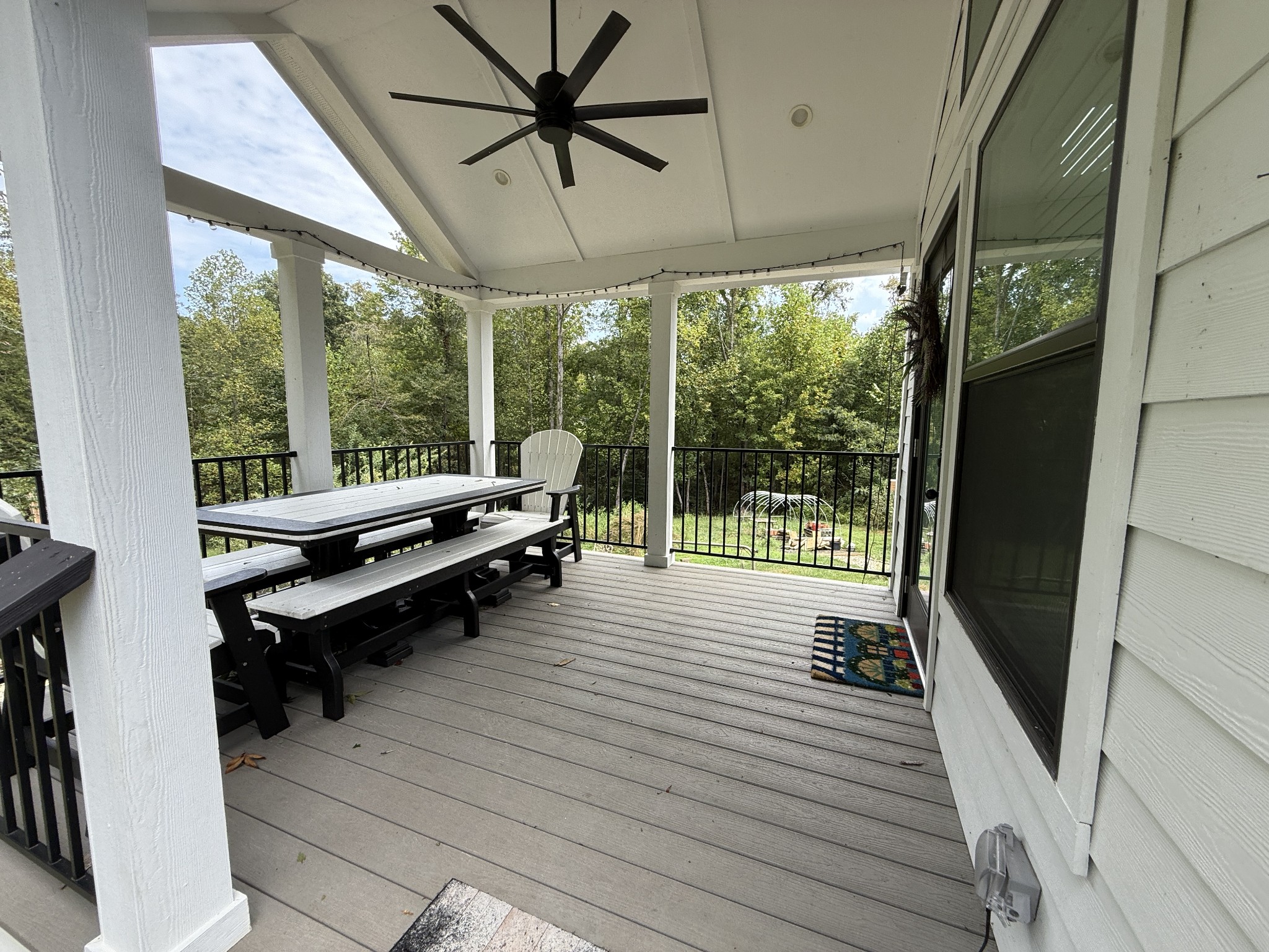 1530 Prince Road Big Sandy, TN 38221 - Photo 23 of 31 a living room with furniture floor to ceiling window