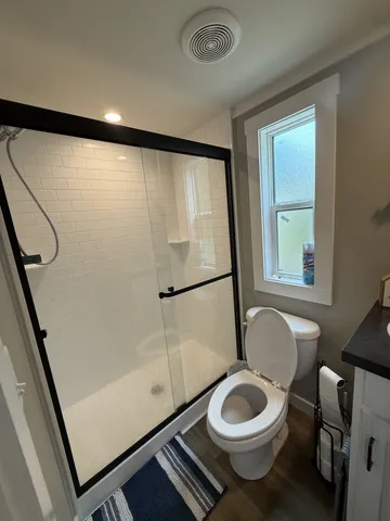 a large kitchen with granite countertop a stove and a sink