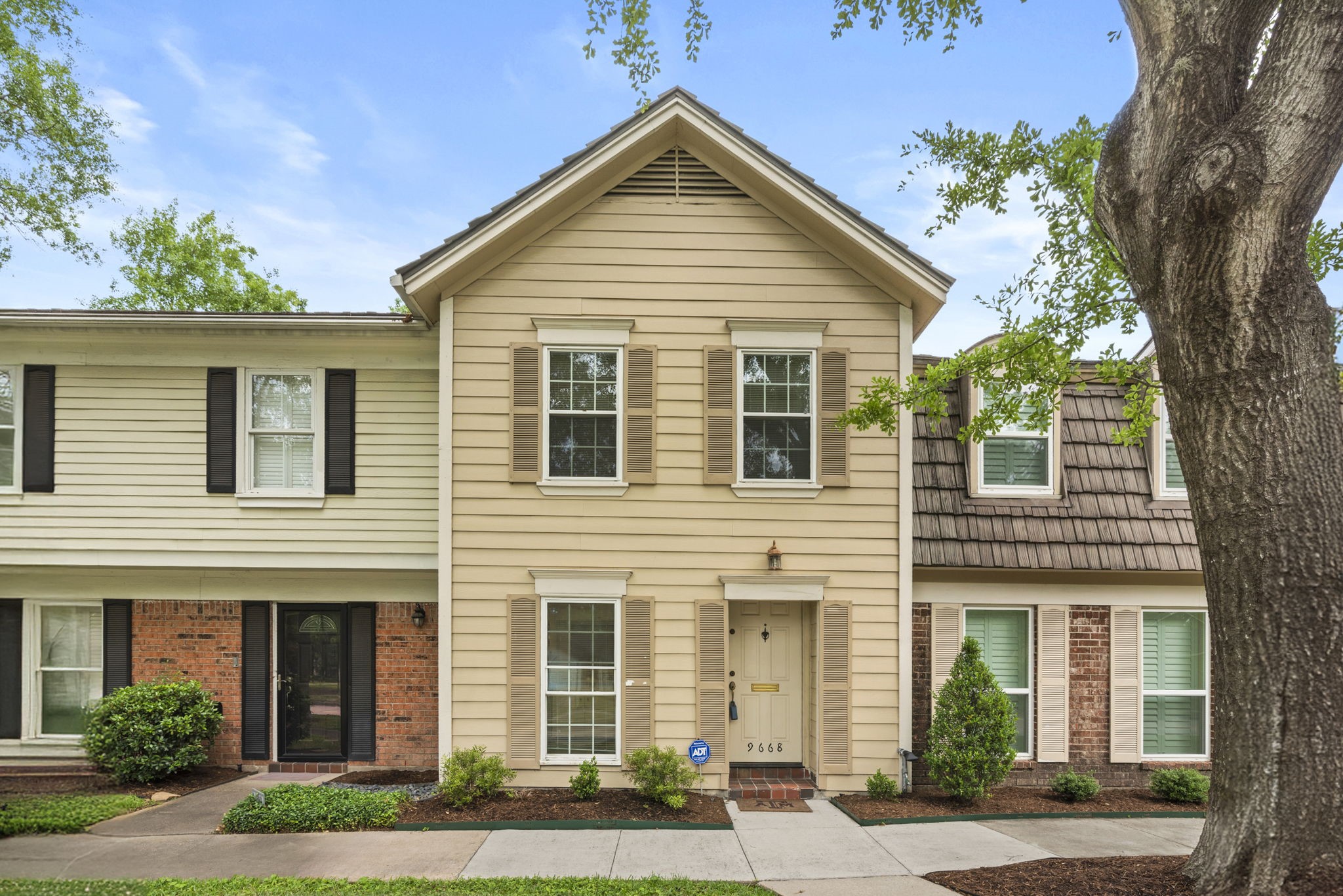 a view of a house and a yard