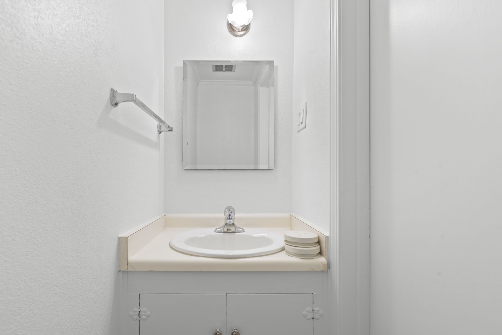 9668 Westview Drive, Unit 2 Houston, TX 77055 - Photo 16 of 34 a bathroom with a sink and a mirror