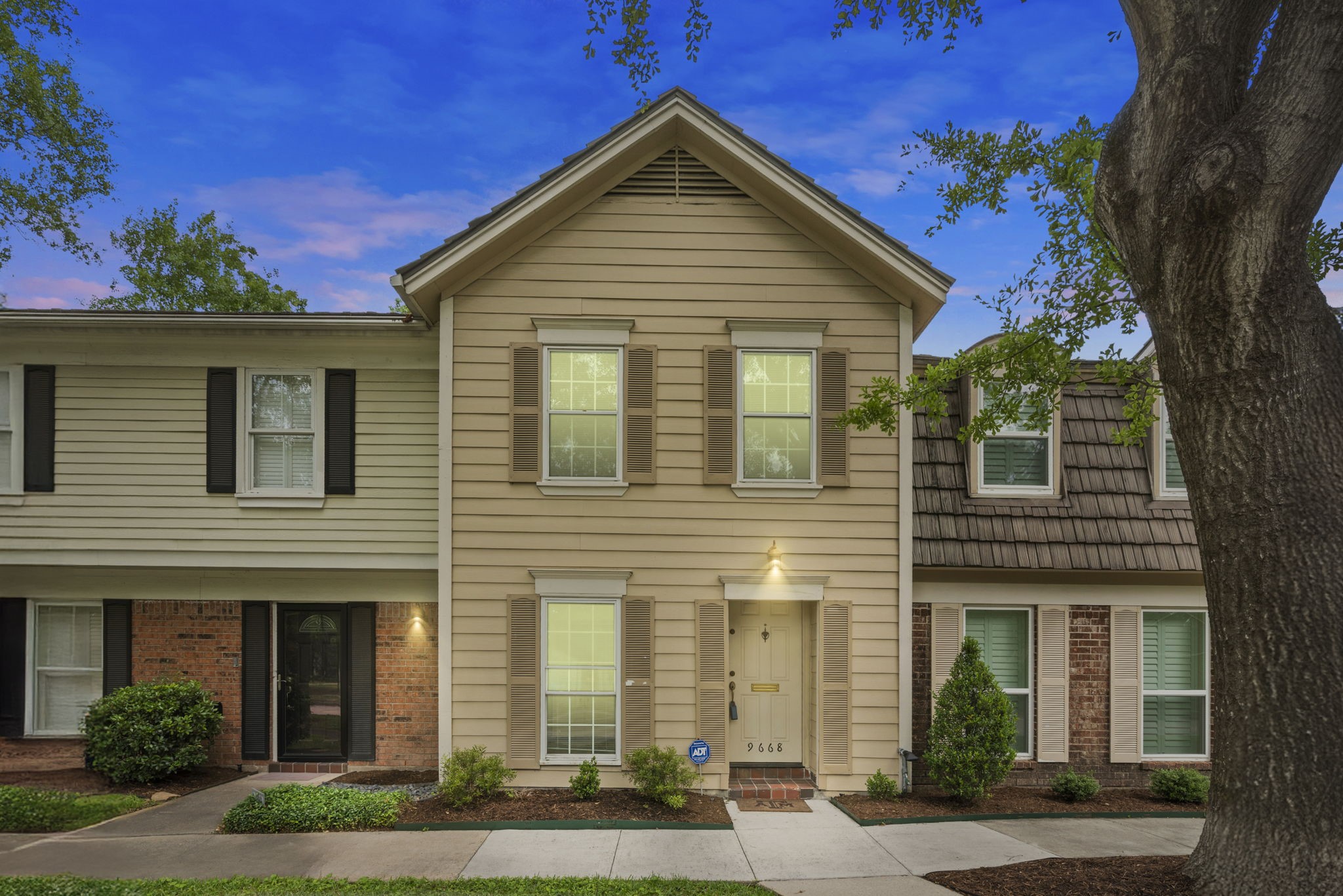 9668 Westview Drive, Unit 2 Houston, TX 77055 - Photo 2 of 34 a front view of a house with a yard