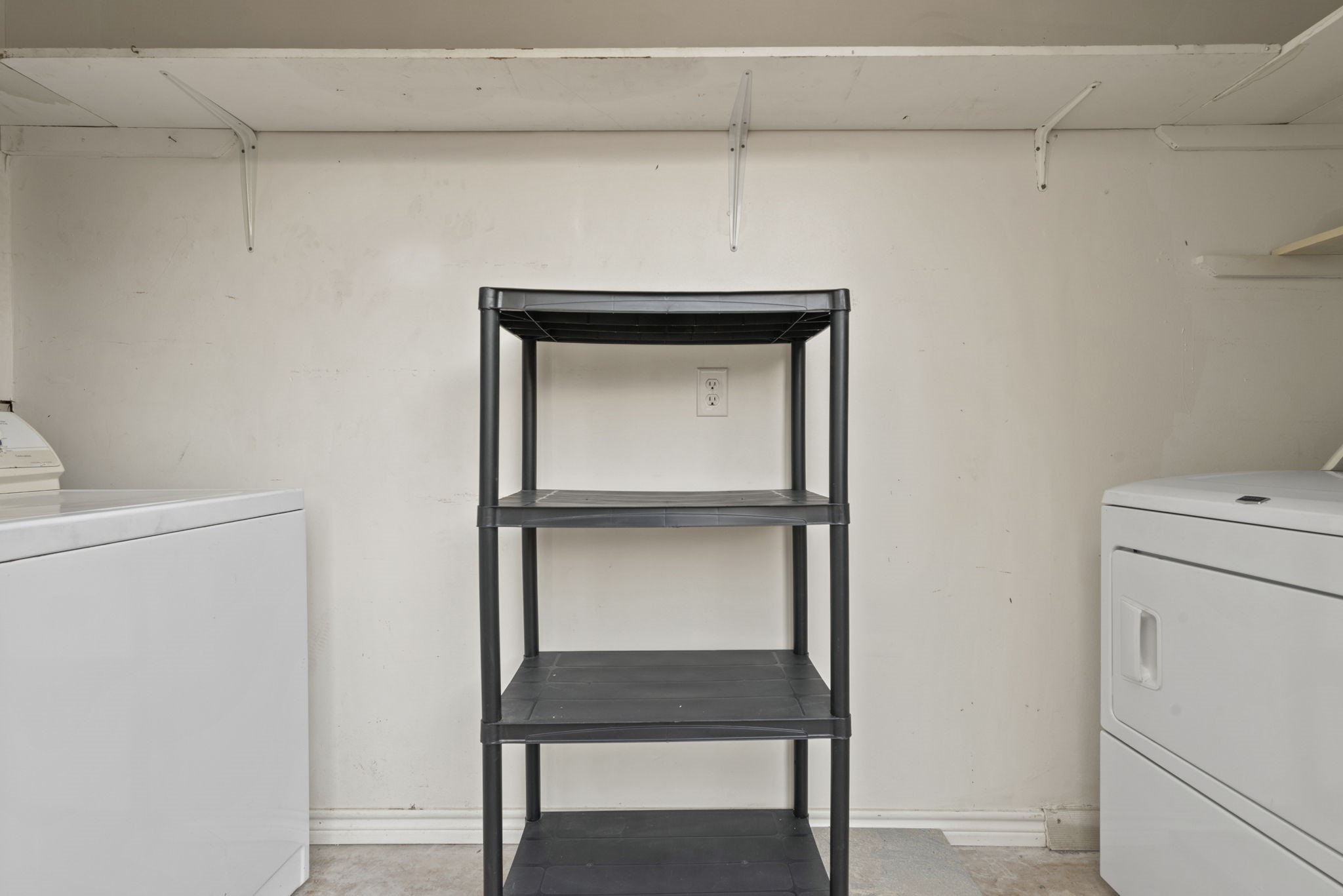 9668 Westview Drive, Unit 2 Houston, TX 77055 - Photo 29 of 34 a view of storage and utility room with closet