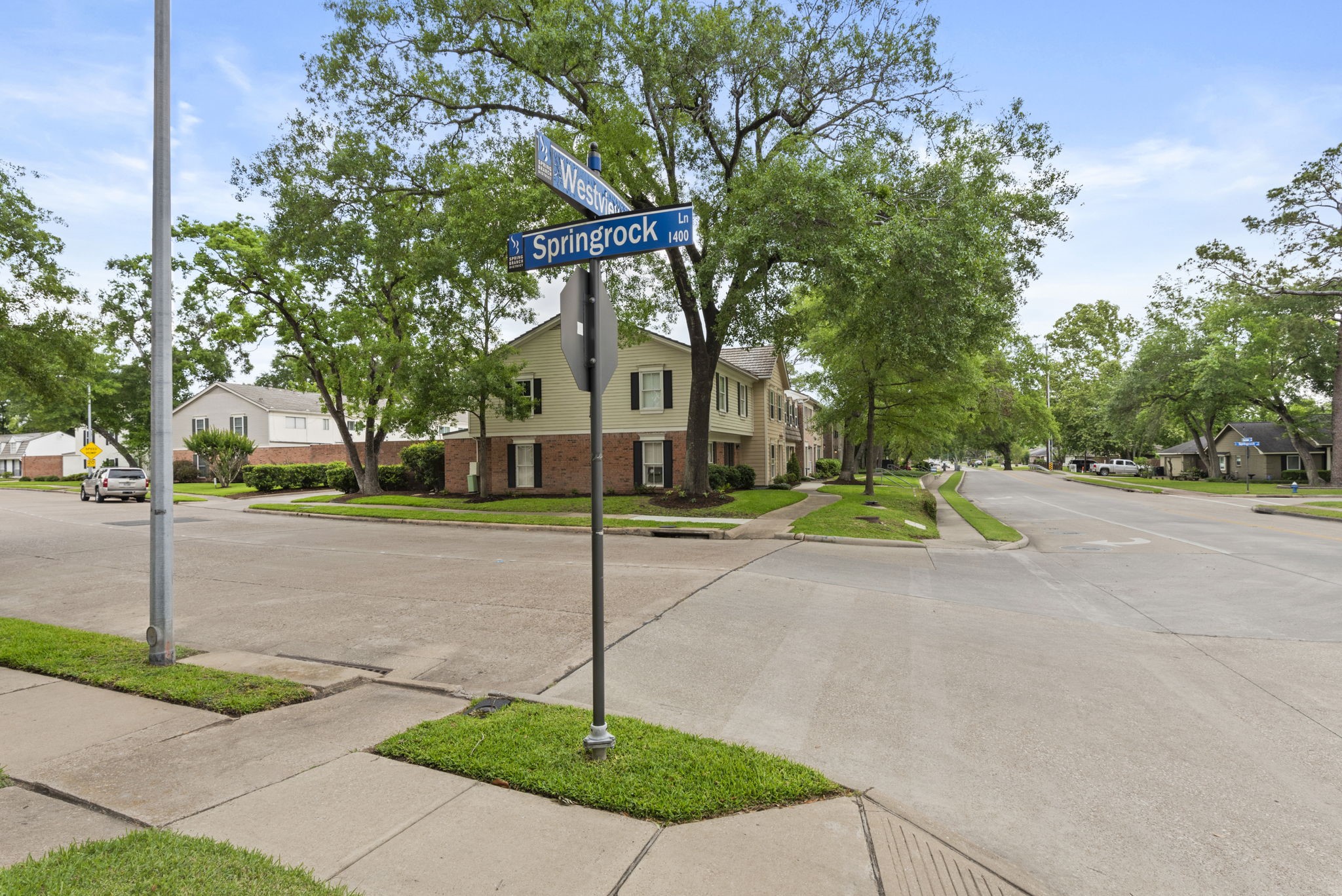 9668 Westview Drive, Unit 2 Houston, TX 77055 - Photo 6 of 34 a view of a street with houses on both side of it