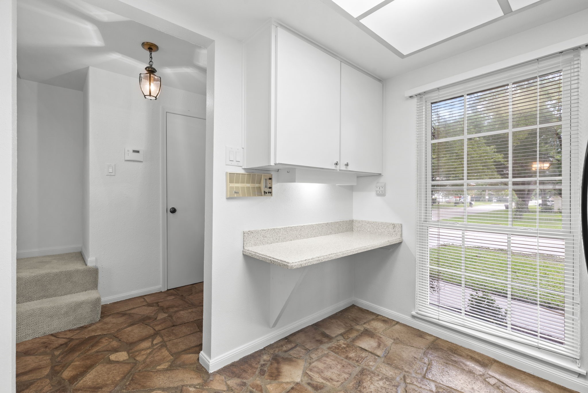 9668 Westview Drive, Unit 2 Houston, TX 77055 - Photo 10 of 34 an empty room with cabinet and entryway