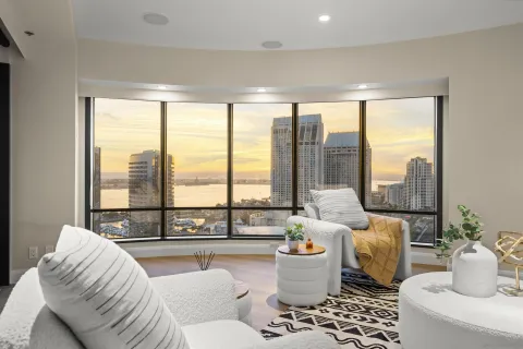 a living room with furniture and a large window