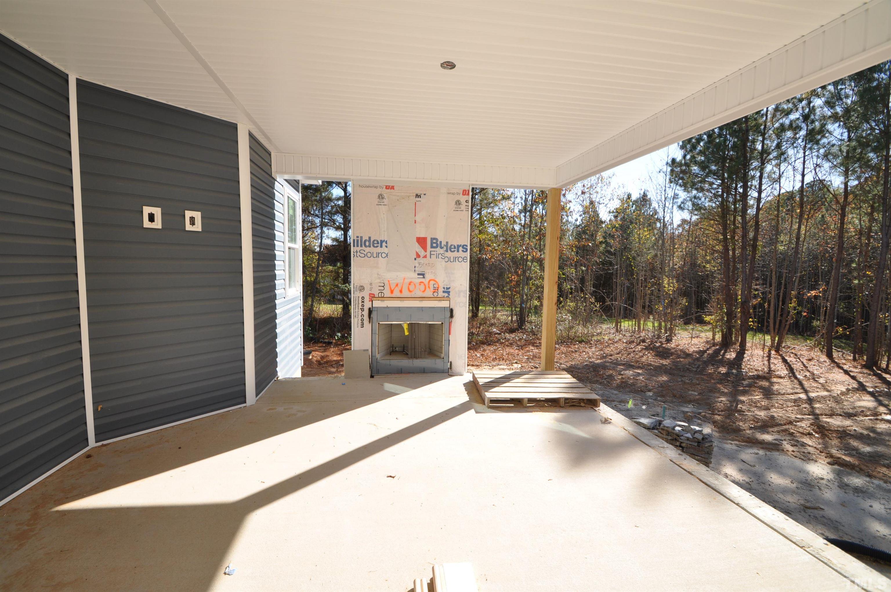 20 Pilot Ridge Road Zebulon, NC 27597 - Photo 12 of 14 a view of a backyard of a house