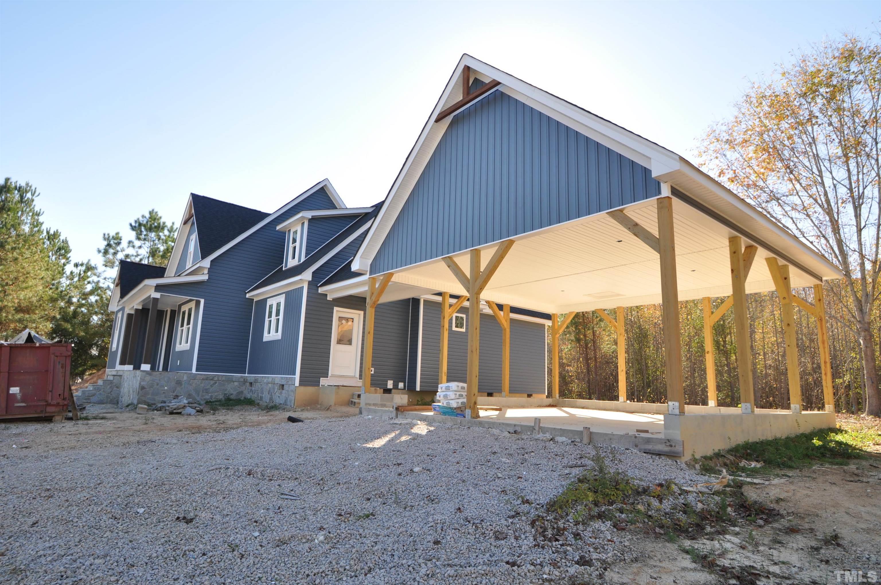 20 Pilot Ridge Road Zebulon, NC 27597 - Photo 14 of 14 a view of a house with backyard and porch