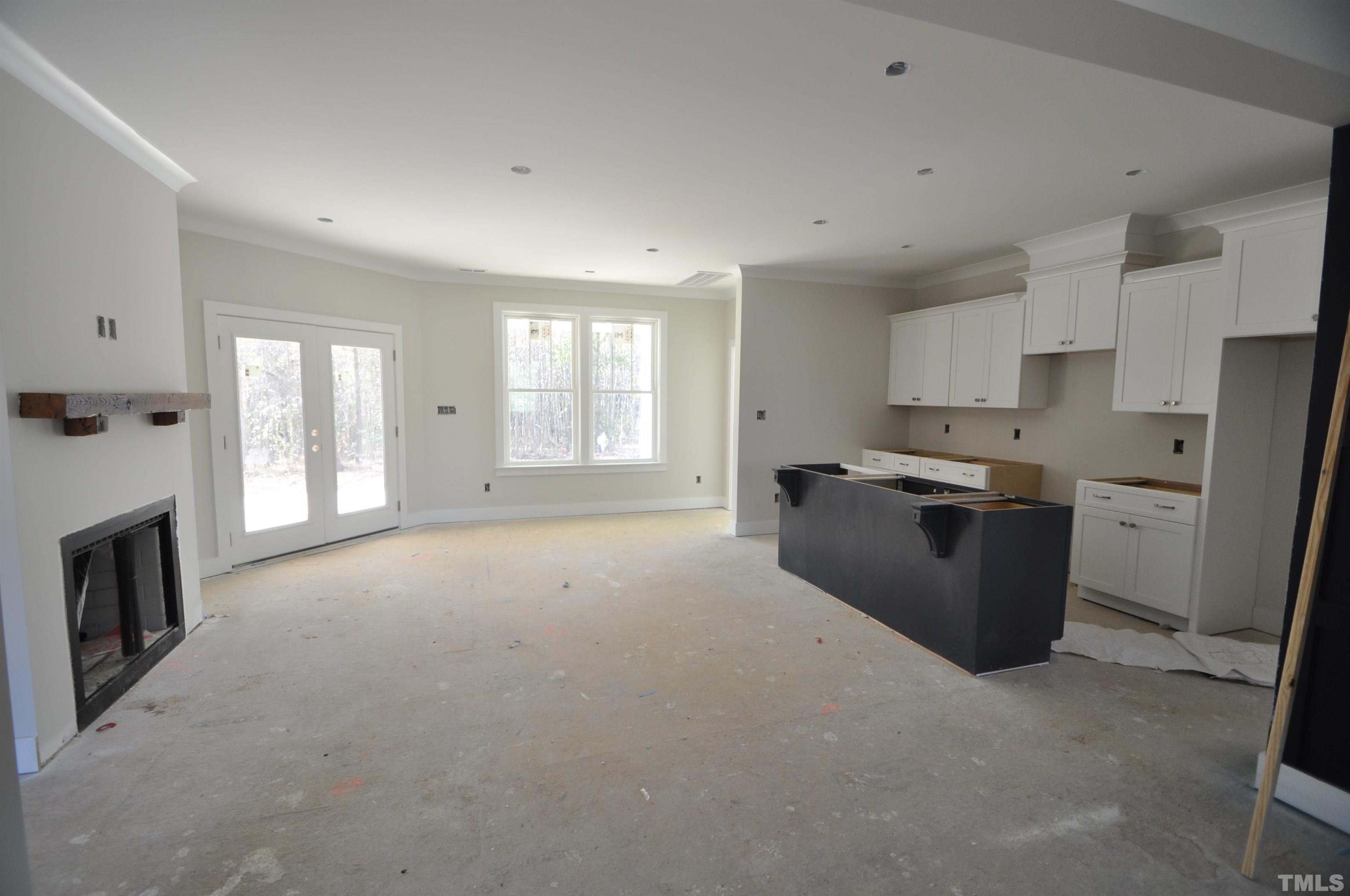 20 Pilot Ridge Road Zebulon, NC 27597 - Photo 3 of 14 a room with kitchen island a sink a stove and a refrigerator