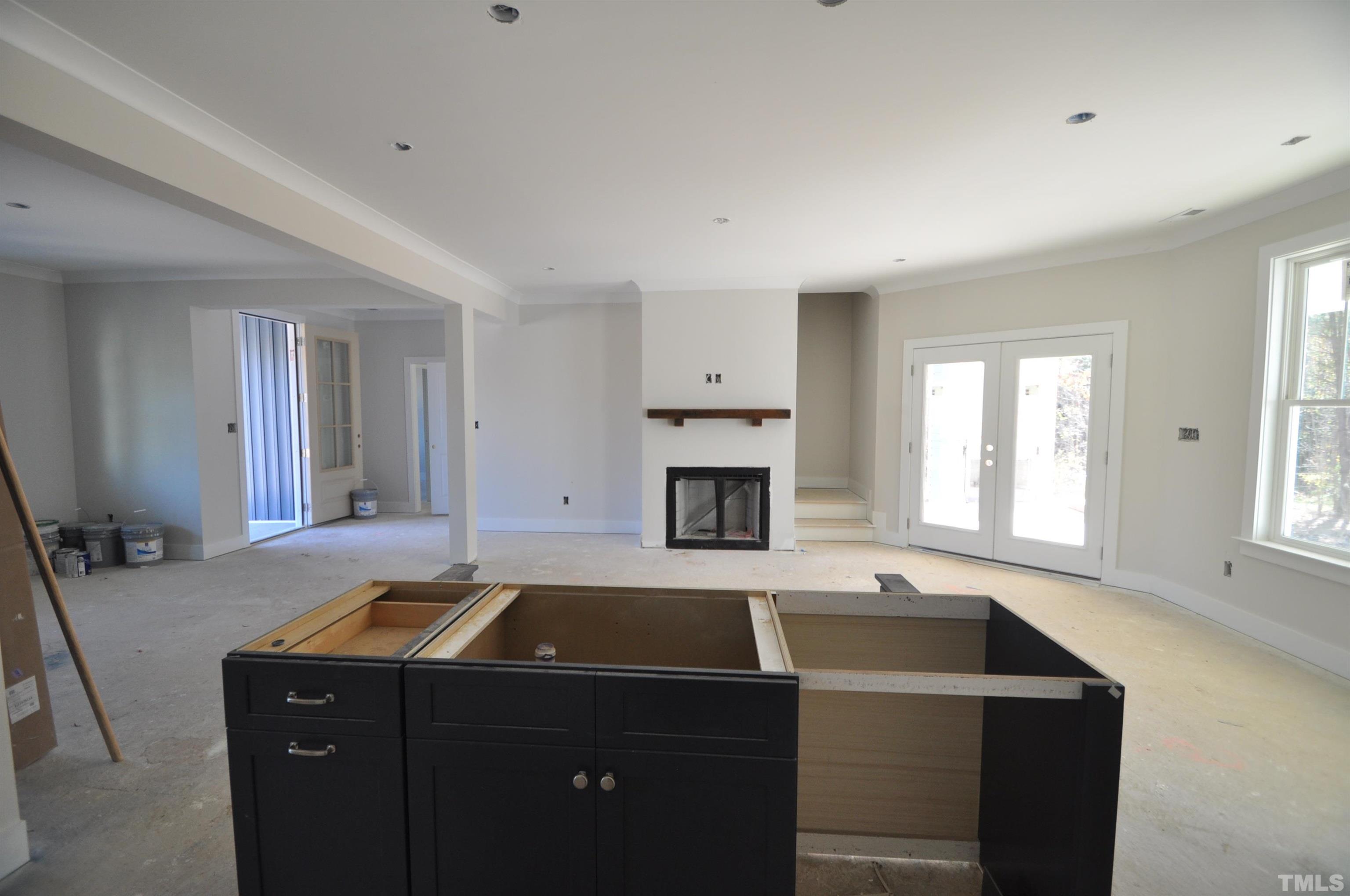 20 Pilot Ridge Road Zebulon, NC 27597 - Photo 5 of 14 a view of a kitchen with a sink dishwasher and a fireplace
