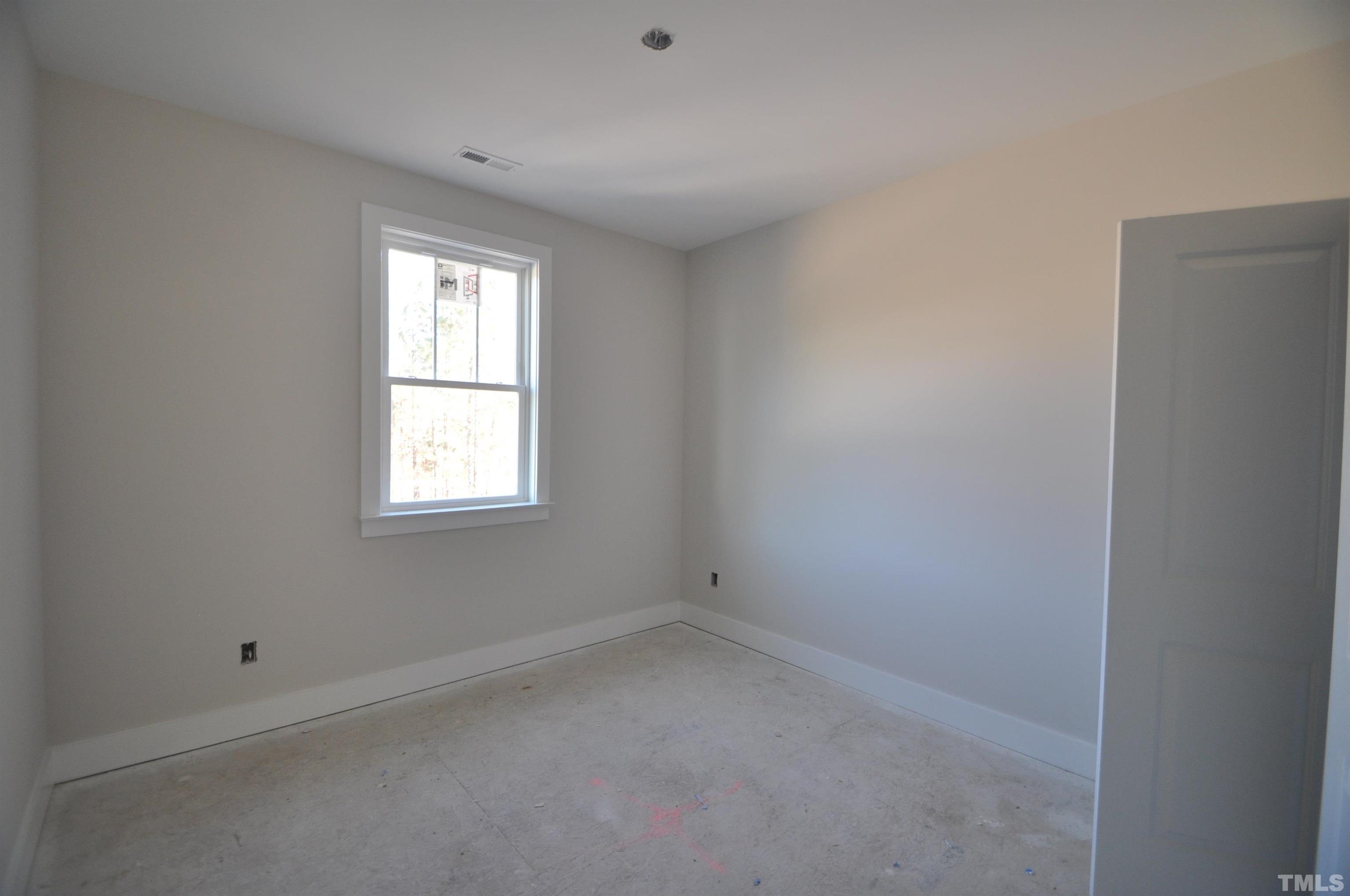 20 Pilot Ridge Road Zebulon, NC 27597 - Photo 8 of 14 an empty room with a window