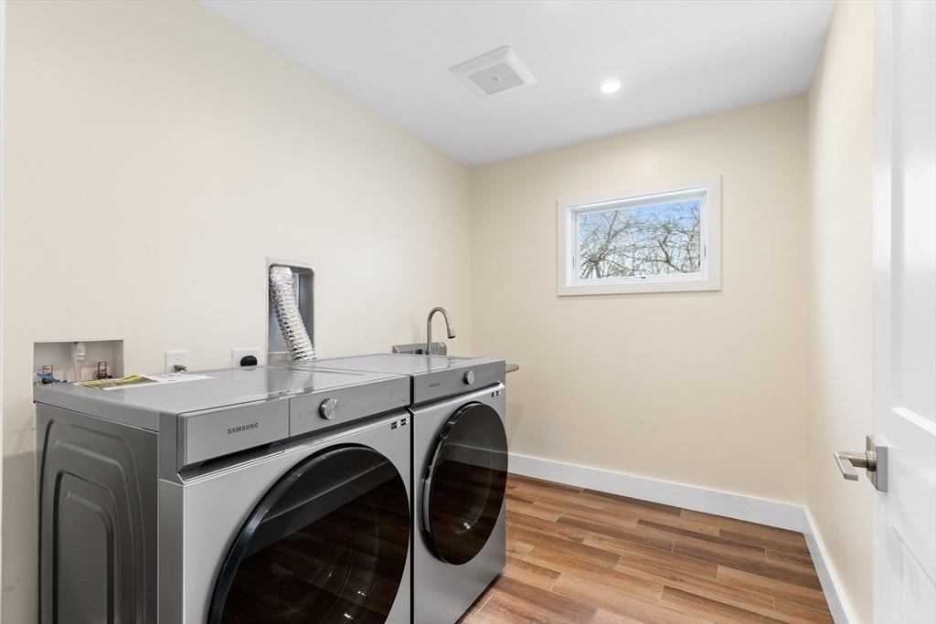 1 Maureen Road Lexington, MA 02420 - Photo 36 of 40 a view of a storage & utility room with washer and dryer