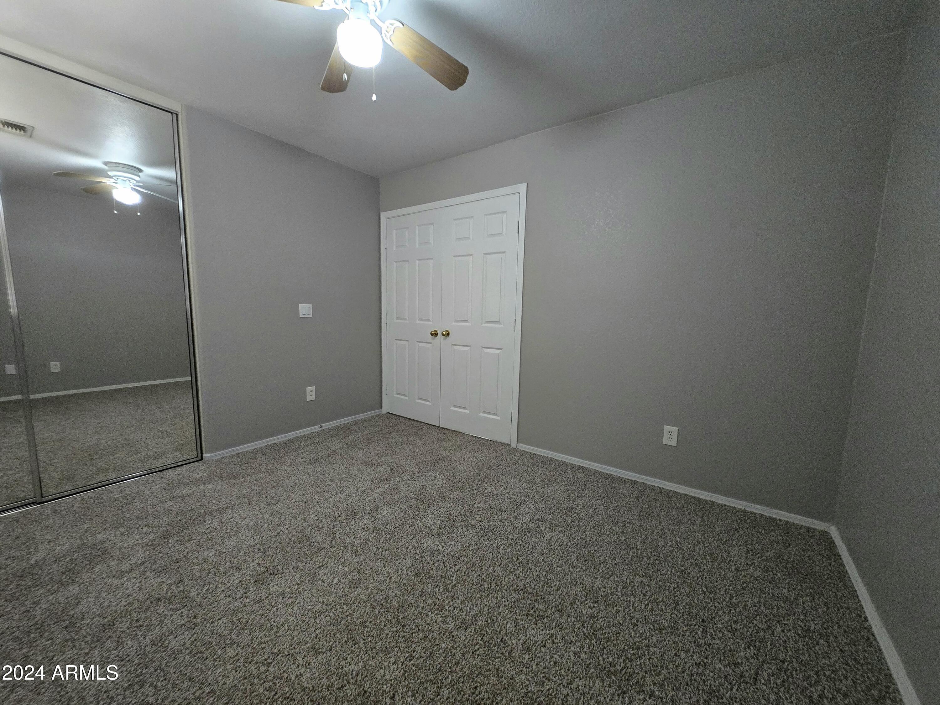 9365 West Eaton Road Phoenix, AZ 85037 - Photo 11 of 30 an empty room with a bathroom