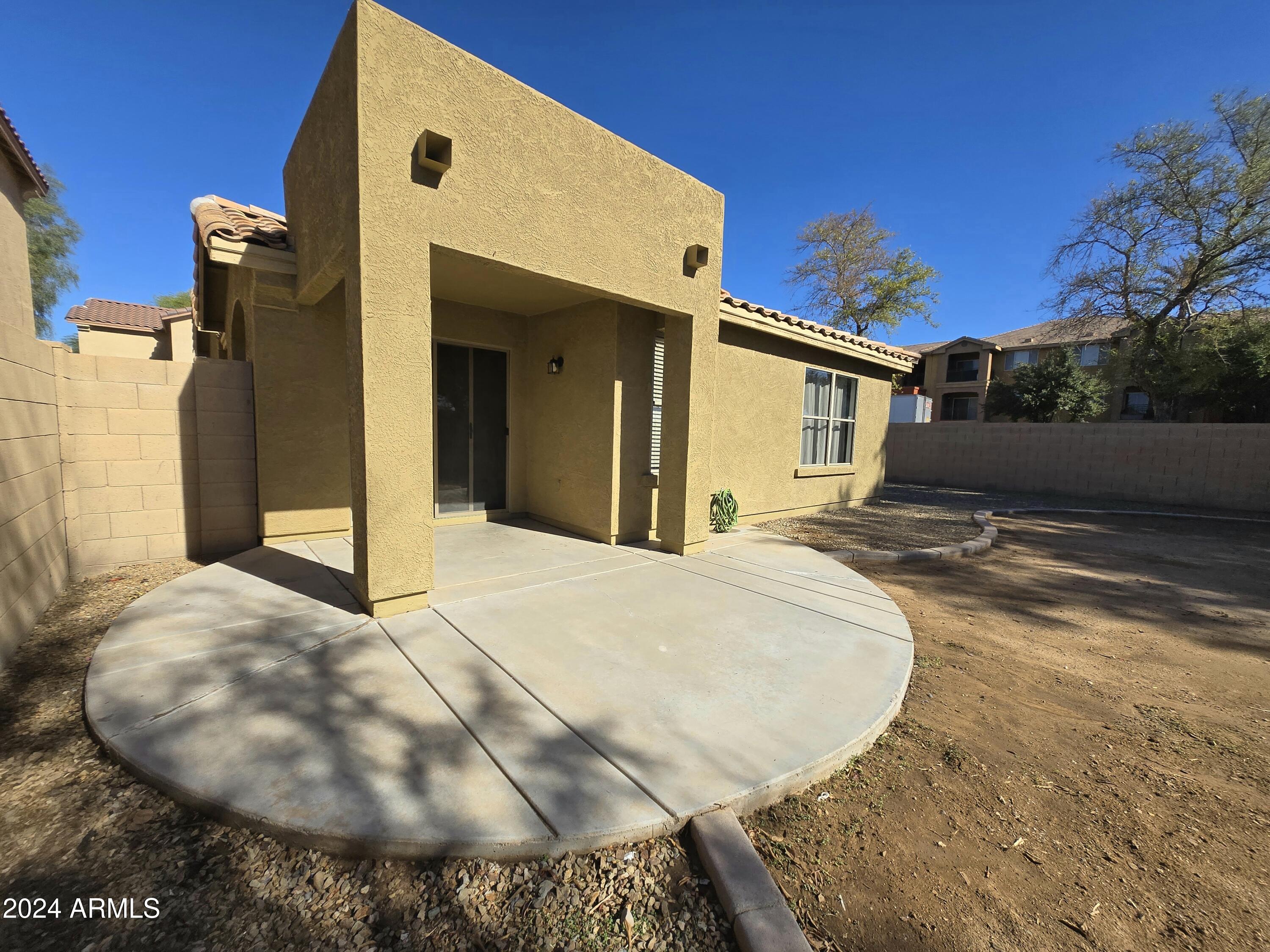 9365 West Eaton Road Phoenix, AZ 85037 - Photo 20 of 30 a view of a house with a backyard