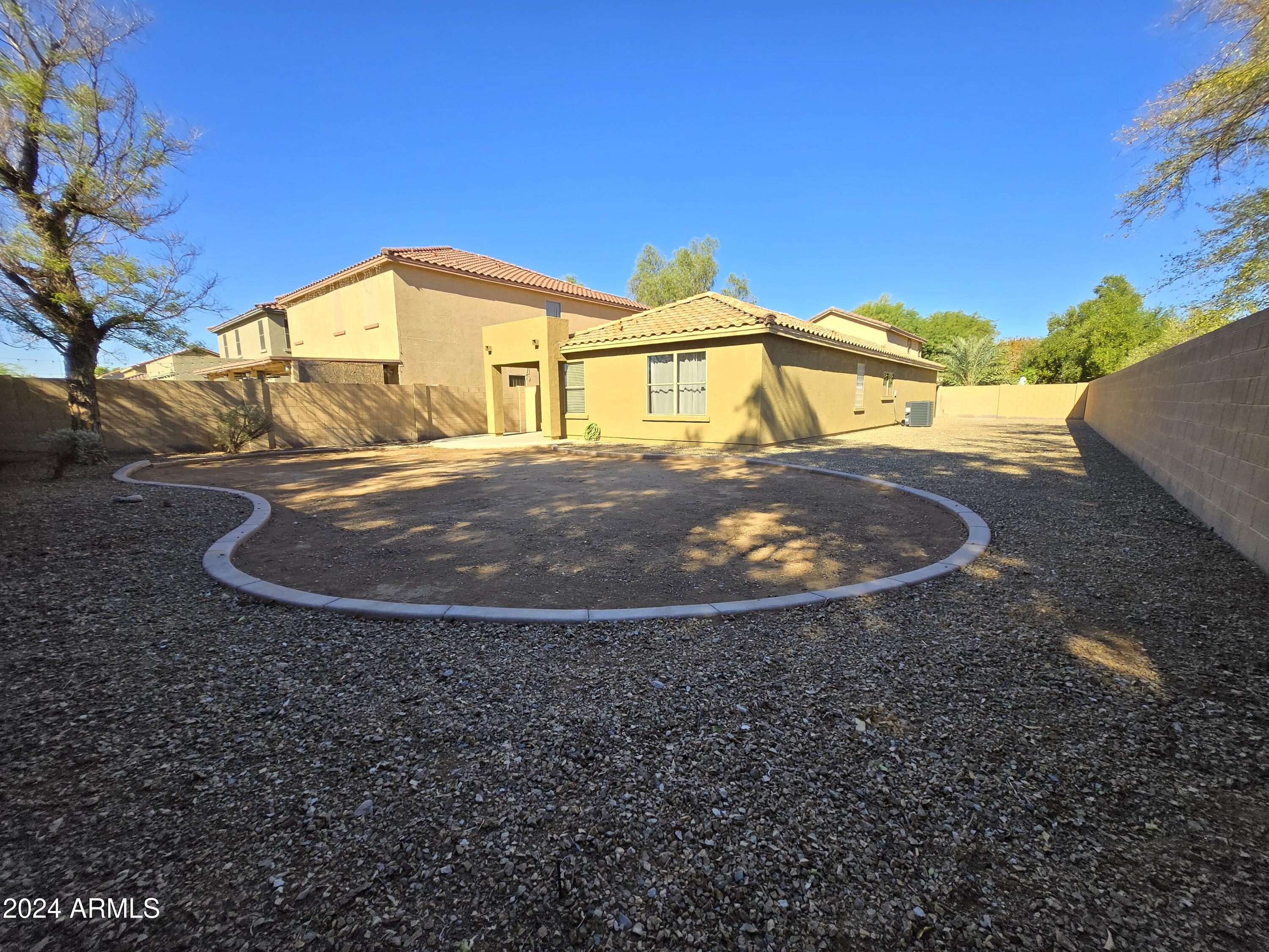 9365 West Eaton Road Phoenix, AZ 85037 - Photo 22 of 30 a view of a backyard